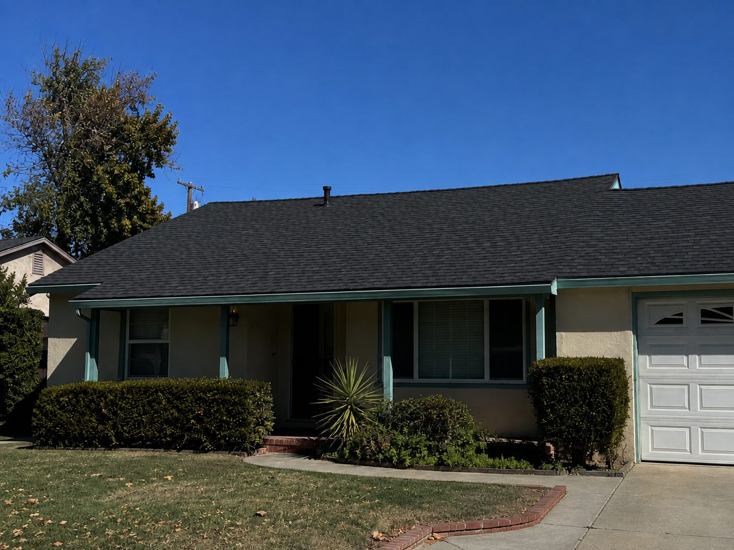 Roof after replacement with architectural shingle